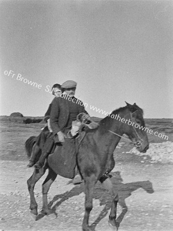 MAN & WOMAN ON HORSEBACK NEAR DUNKINEELY